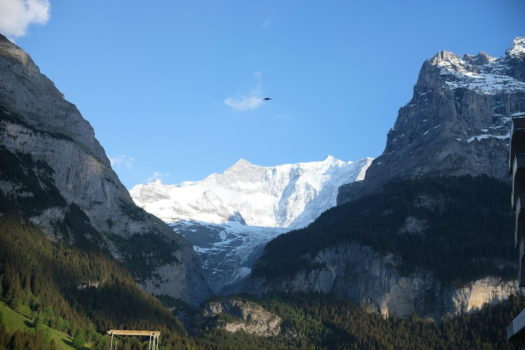 Documentary film crew filming an interview in the Swiss Alps